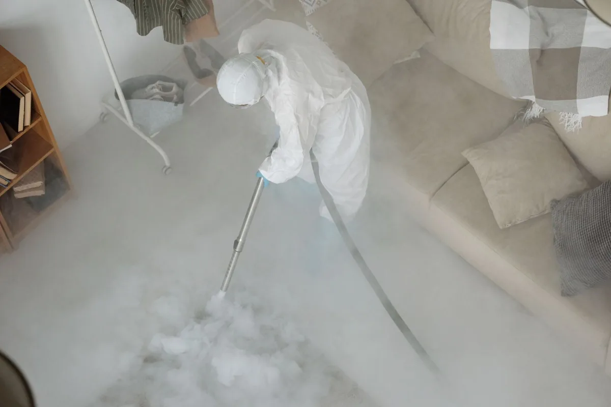 Biohazard cleanup technician in protective equipment, North Amityville, NY